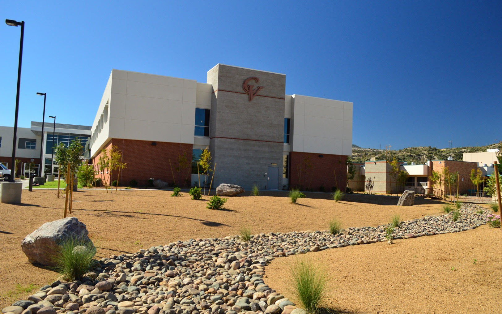 Wide daytime view of the Cobre Valley Regional Medical Center building with a dimensional logo on the central tower