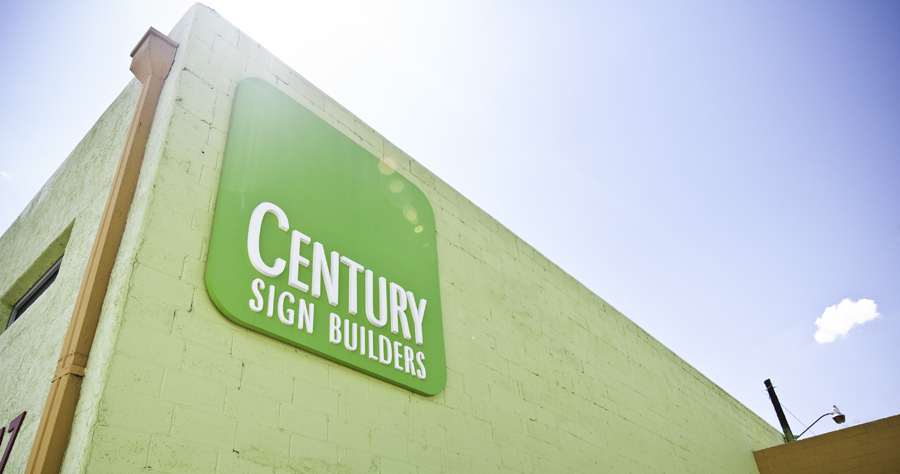 Dimensional Building logo on green building