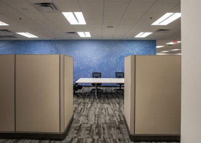 Detailed view of blueprint wall super graphics showing architectural linework and large scale environmental graphics in corporate office