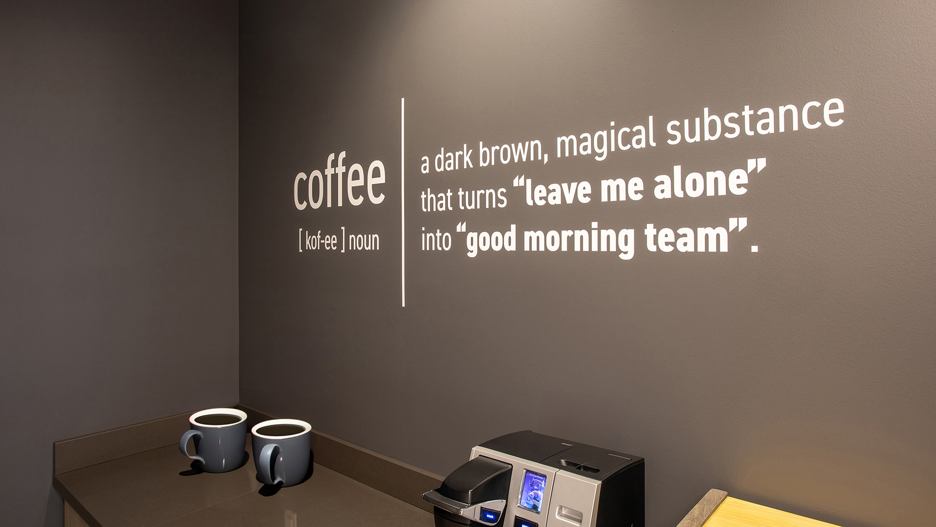 Caliente Construction Fitness Room Wall Graphics | Motivational Vinyl Graphics Phoenix AZ Fitness room featuring motivational word cloud wall graphics in corporate office environment