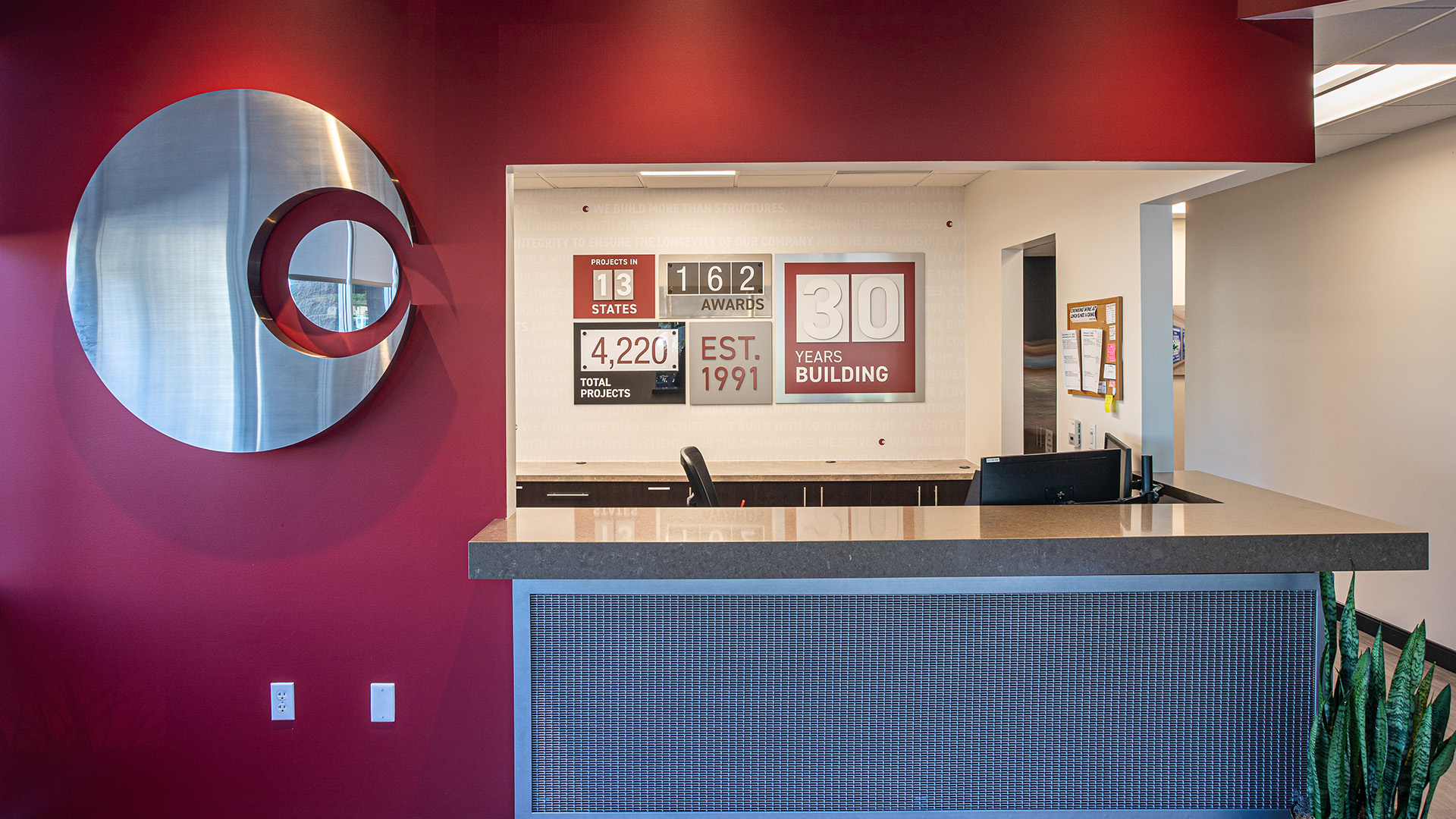 Close up detail of fabricated steel channel logo with brushed finish in corporate office environment