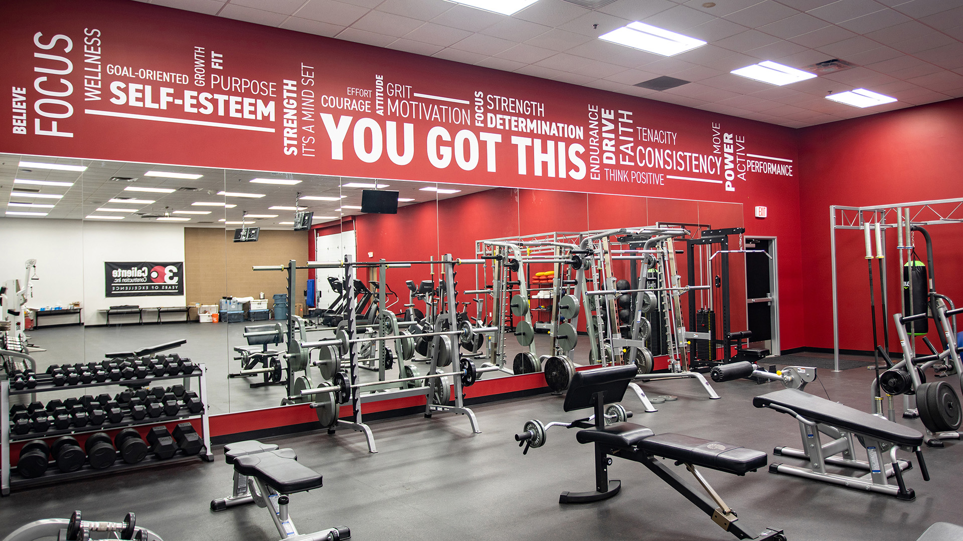 Subtle tone on tone wall graphics with company messaging integrated into interior space