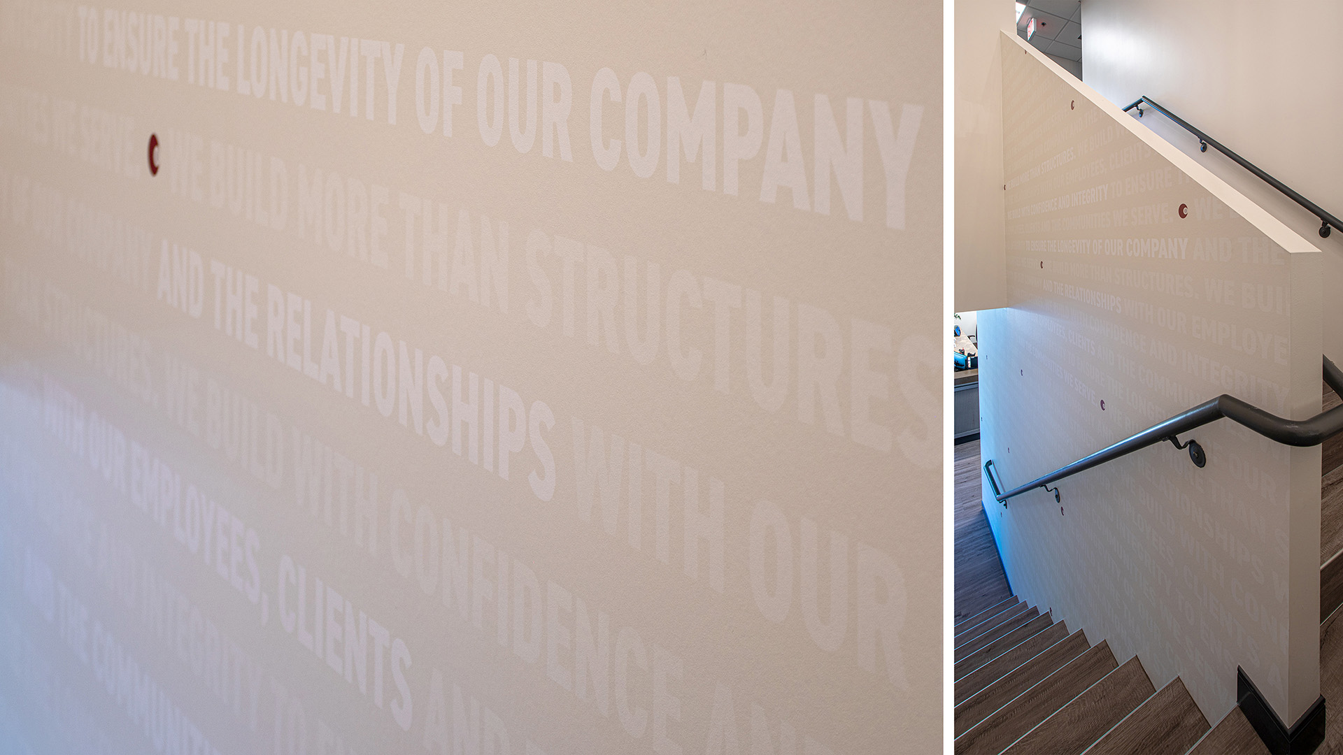 Hands changing interchangeable panel on updateable signage system at Caliente Construction office
