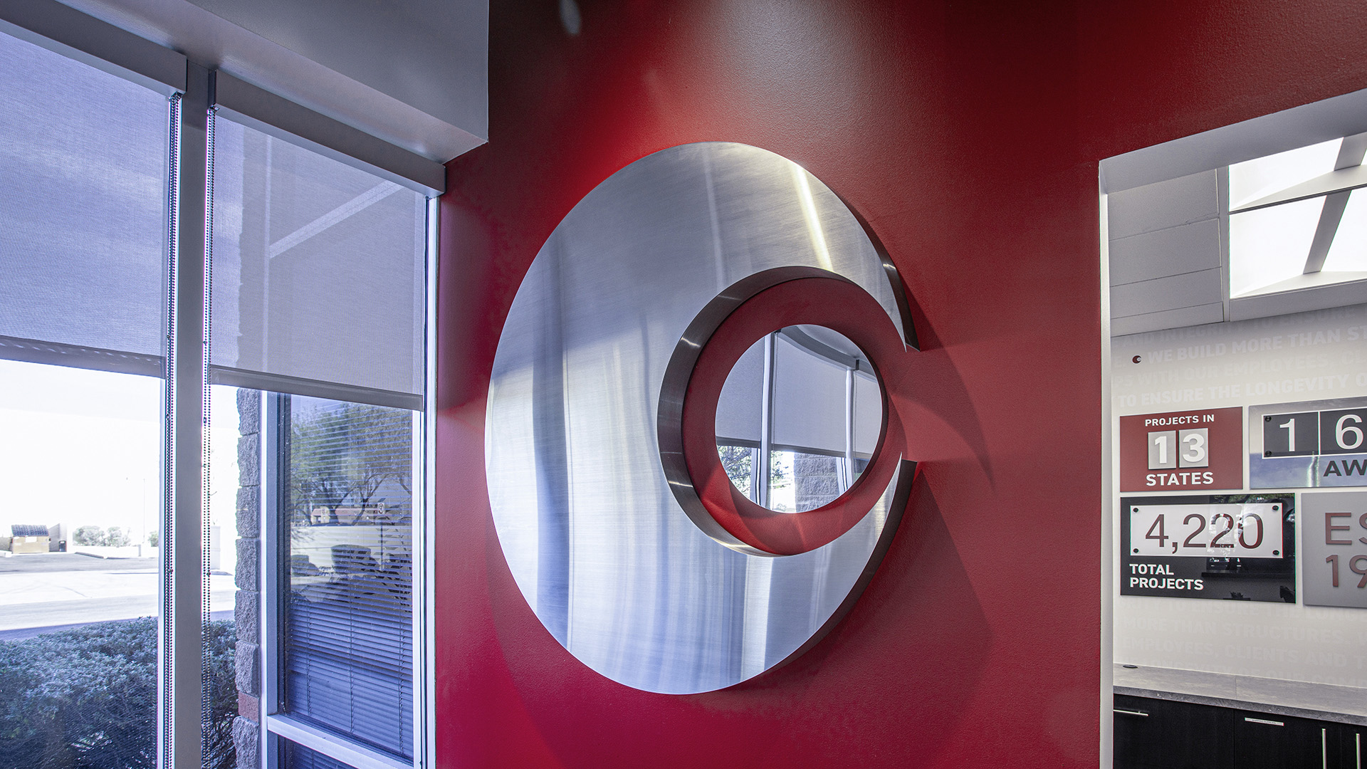 Close up of interchangeable panels on updateable wow wall display at Caliente Construction office in Phoenix Arizona