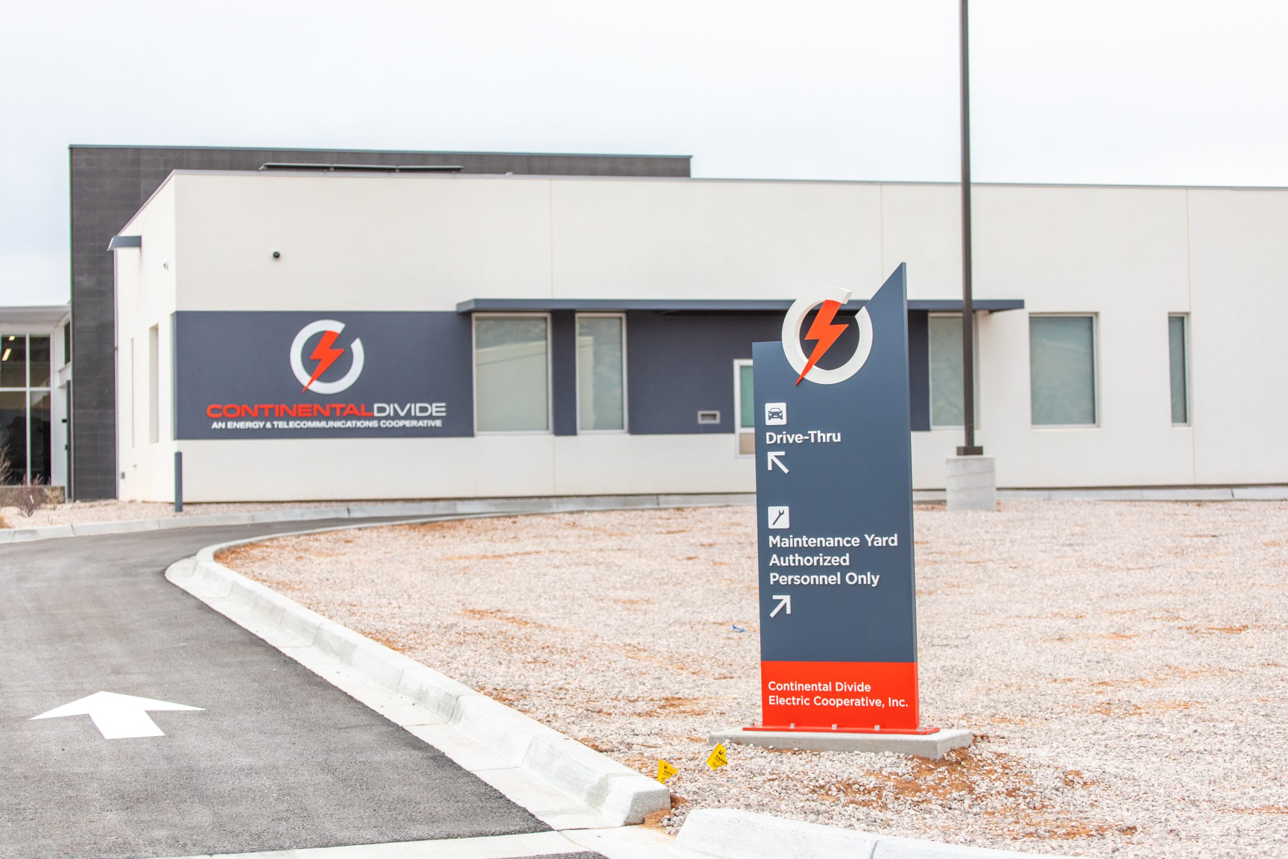 directional sign indicating drive-thru and maintenance yard access