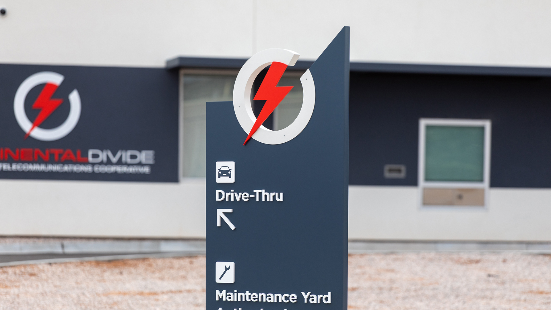 monument style wayfinding sign with directional information