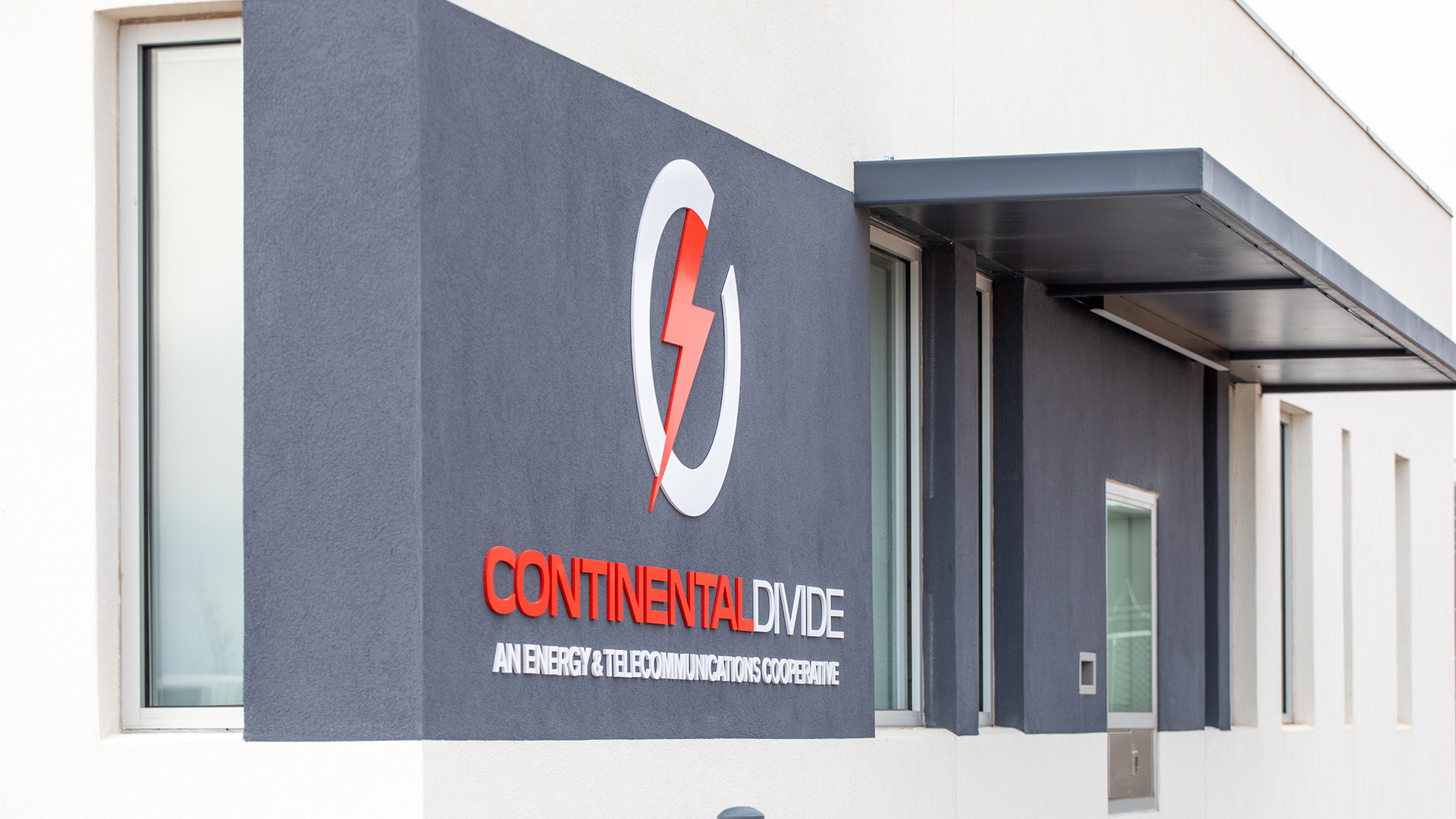 dimensional acrylic logo mounted on exterior wall