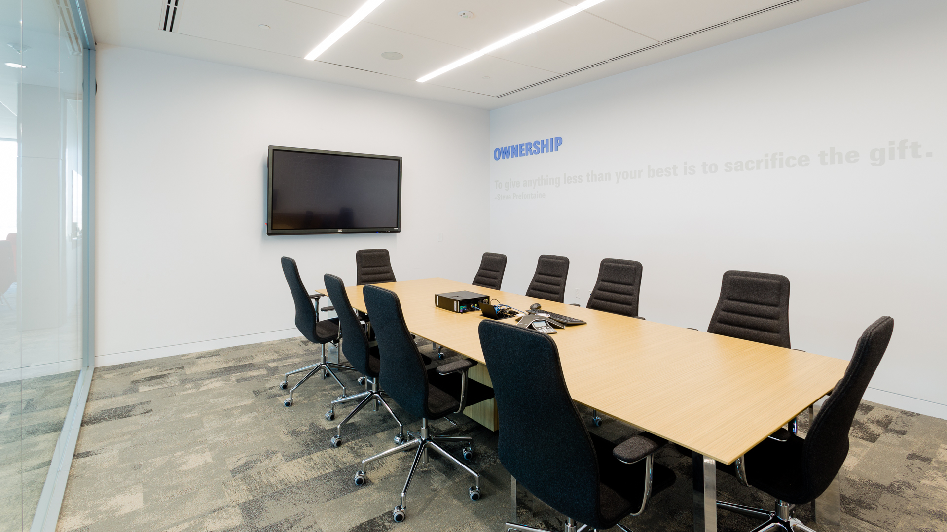 Conference room environmental graphics featuring Ownership value with dimensional acrylic lettering at New Mexico Mutual Albuquerque