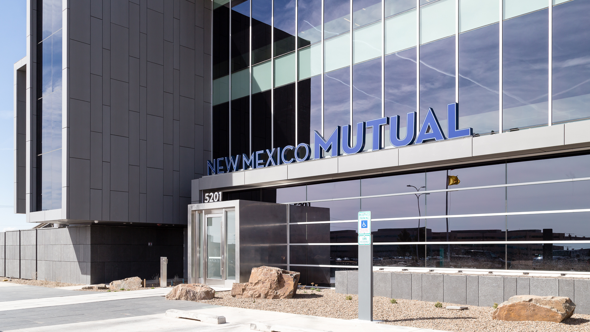 Exterior view of bottom mounted fabricated channel letters on New Mexico Mutual building in Albuquerque