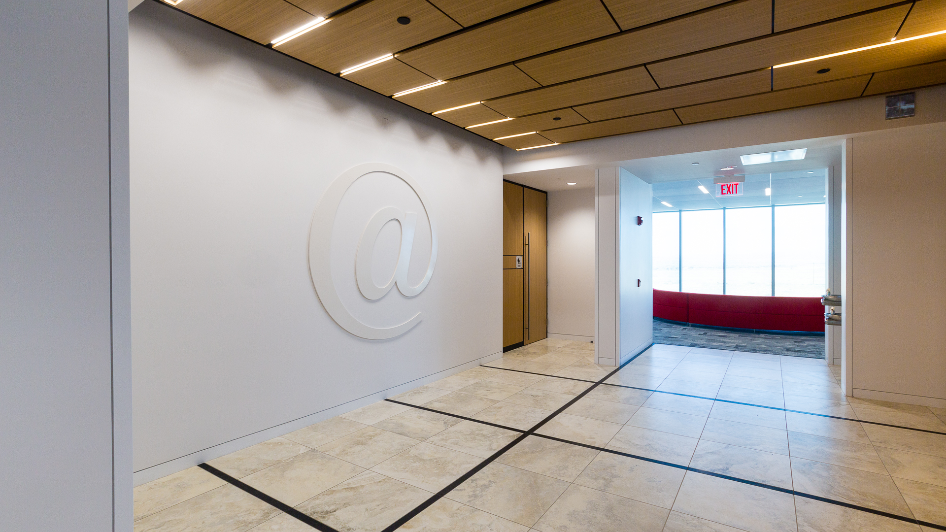 Large dimensional at symbol wall feature in elevator lobby at New Mexico Mutual Albuquerque