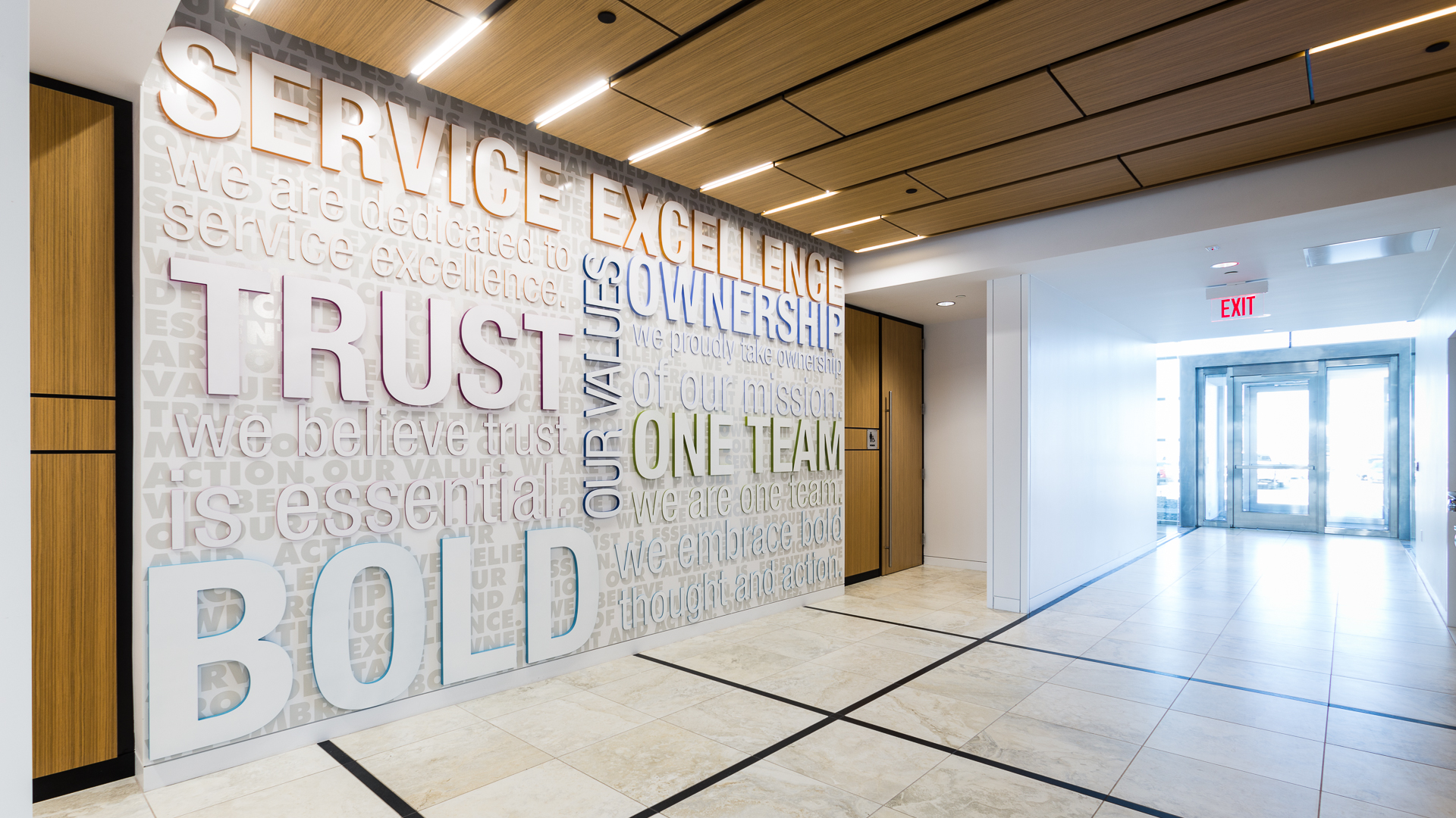 New Mexico Mutual Lobby Values Wall Environmental Graphics First floor lobby environmental graphics values wall with dimensional acrylic lettering at New Mexico Mutual in Albuquerque