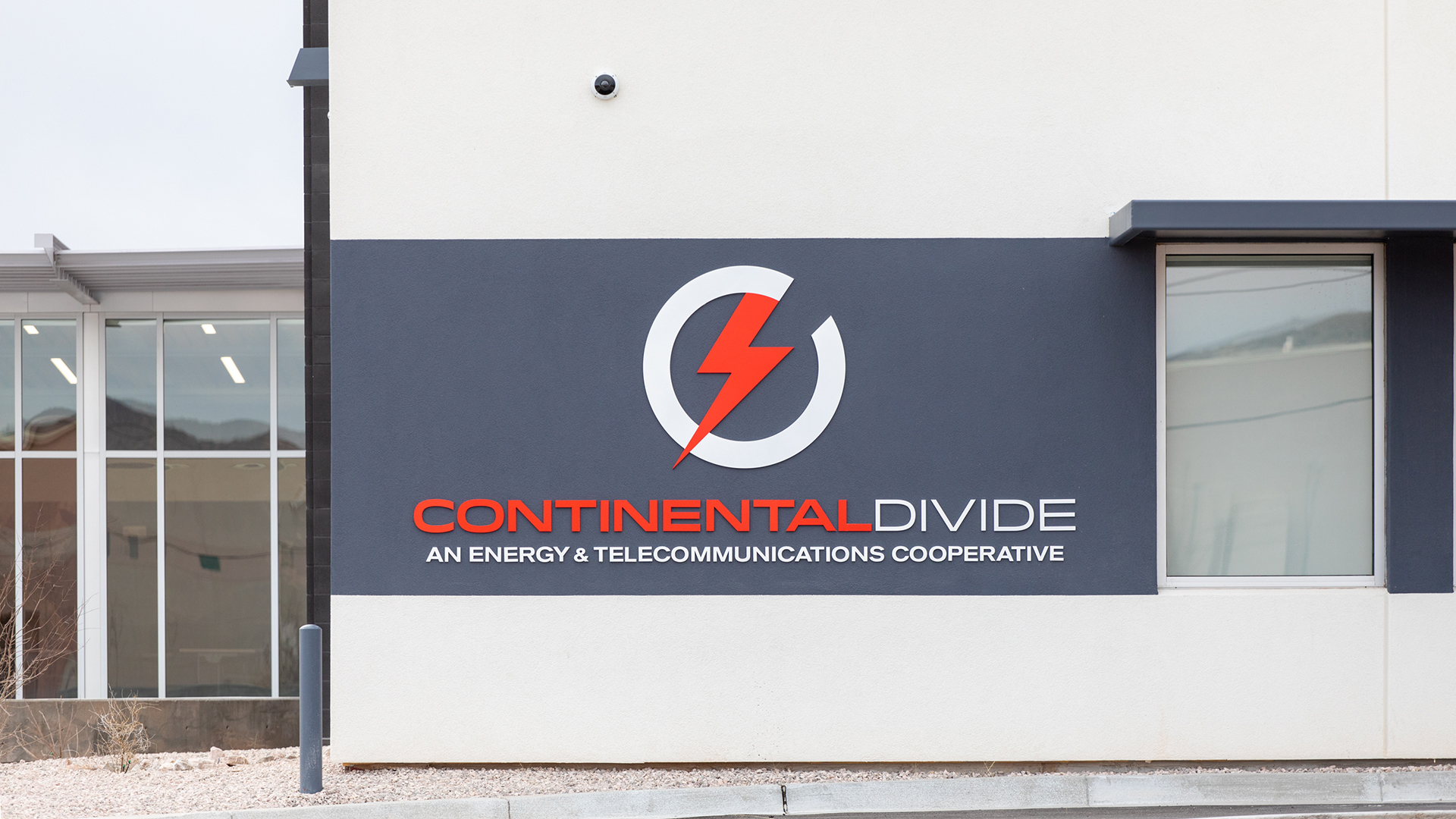 wall mounted logo sign on exterior building facade