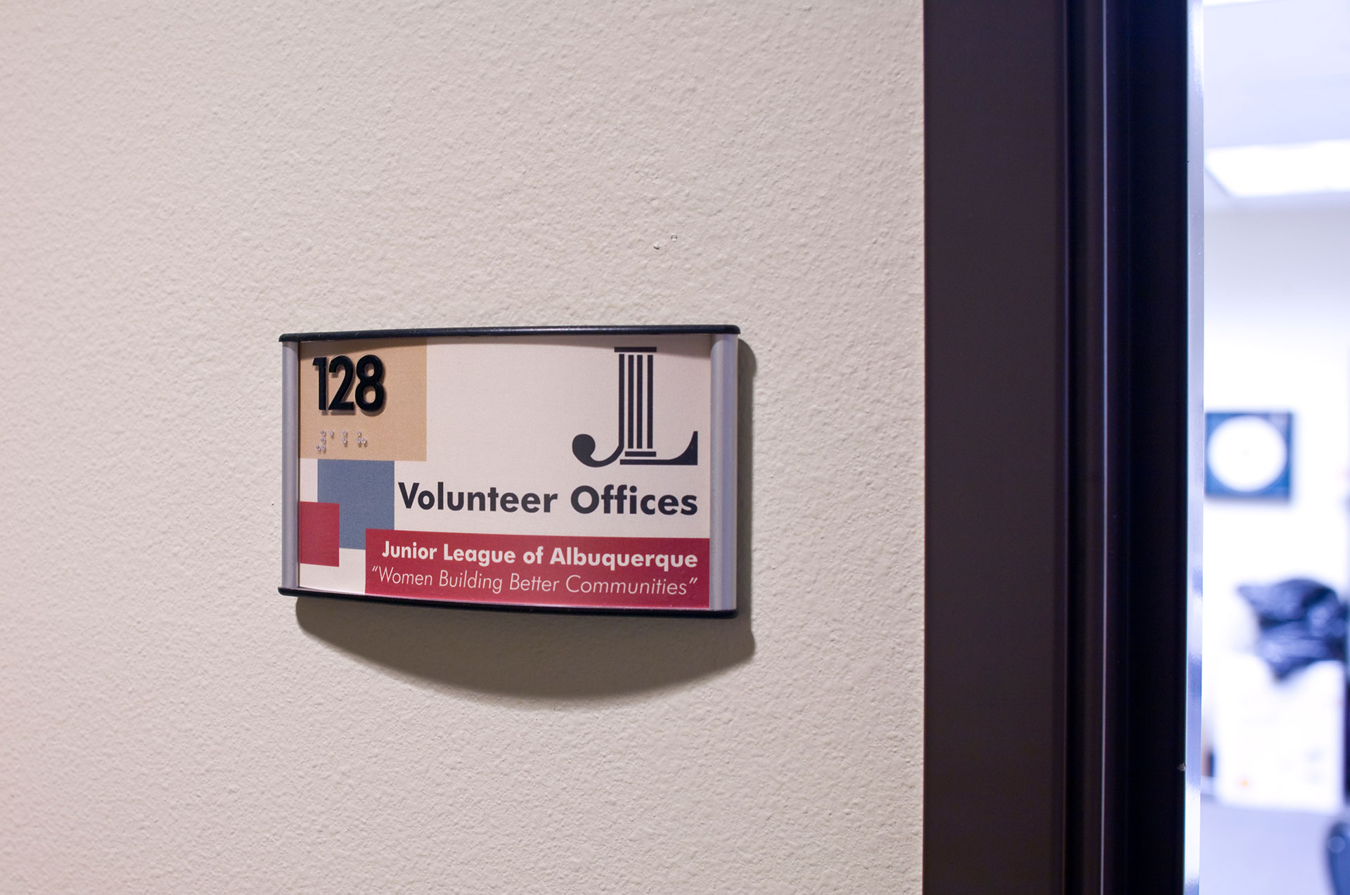 Interior ADA compliant room identification sign with braille and modular insert