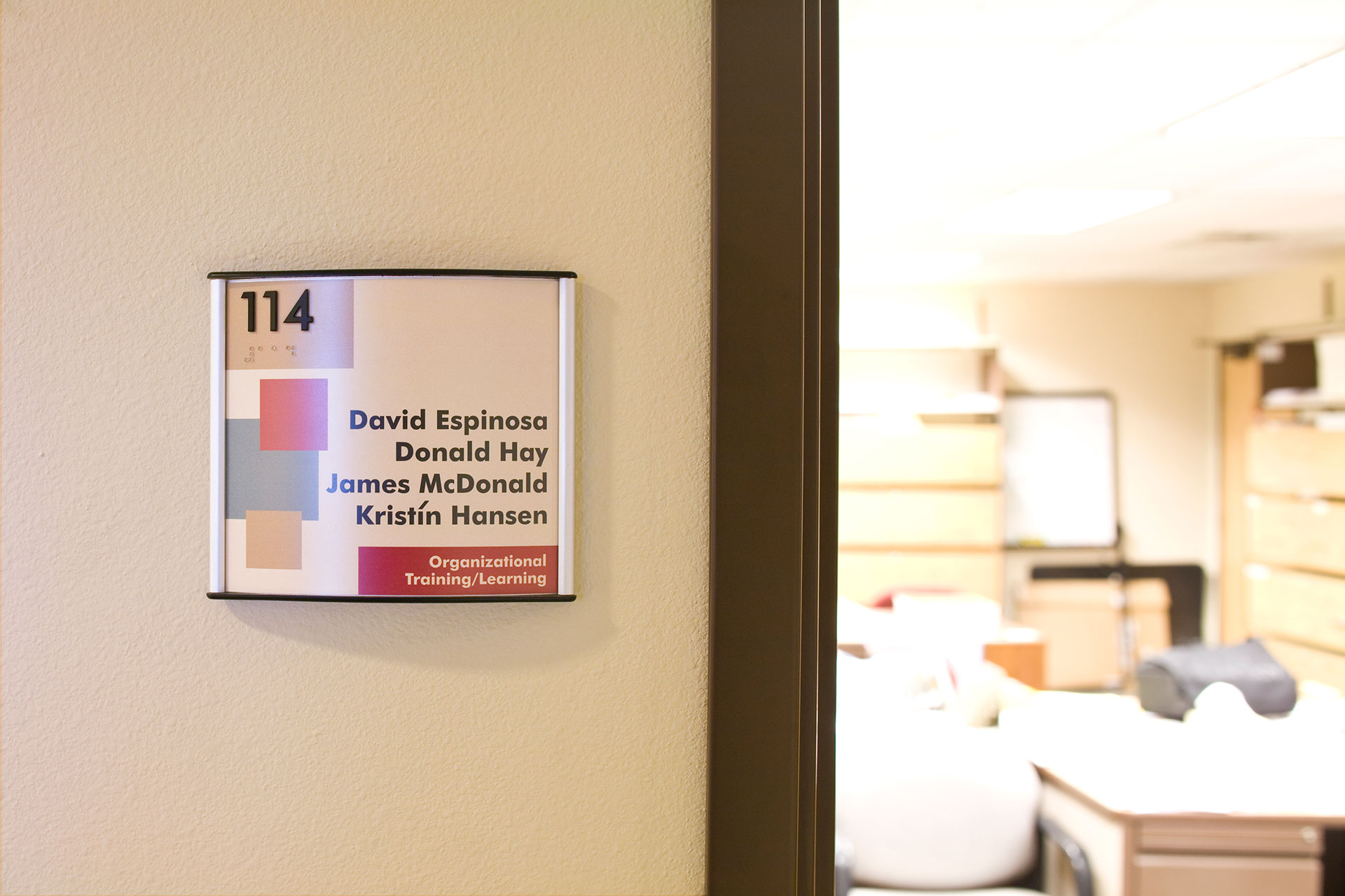 Office room sign with colorful branded insert using Diversity Sign System