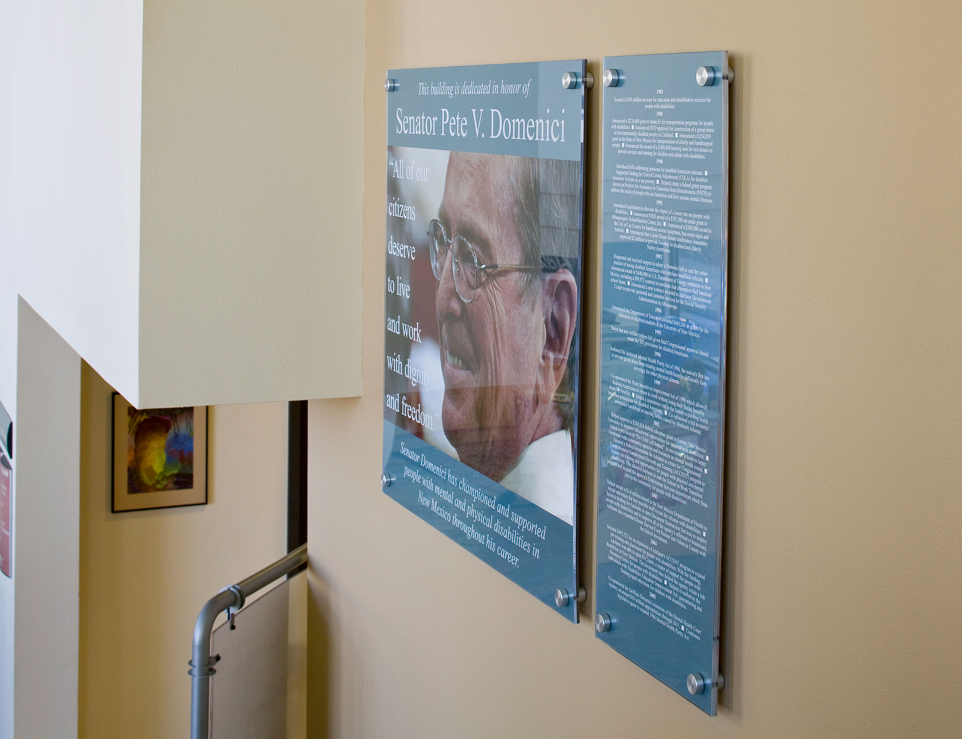 Acrylic dedication panel honoring Senator Pete Domenici with standoff-mounted layered graphics
