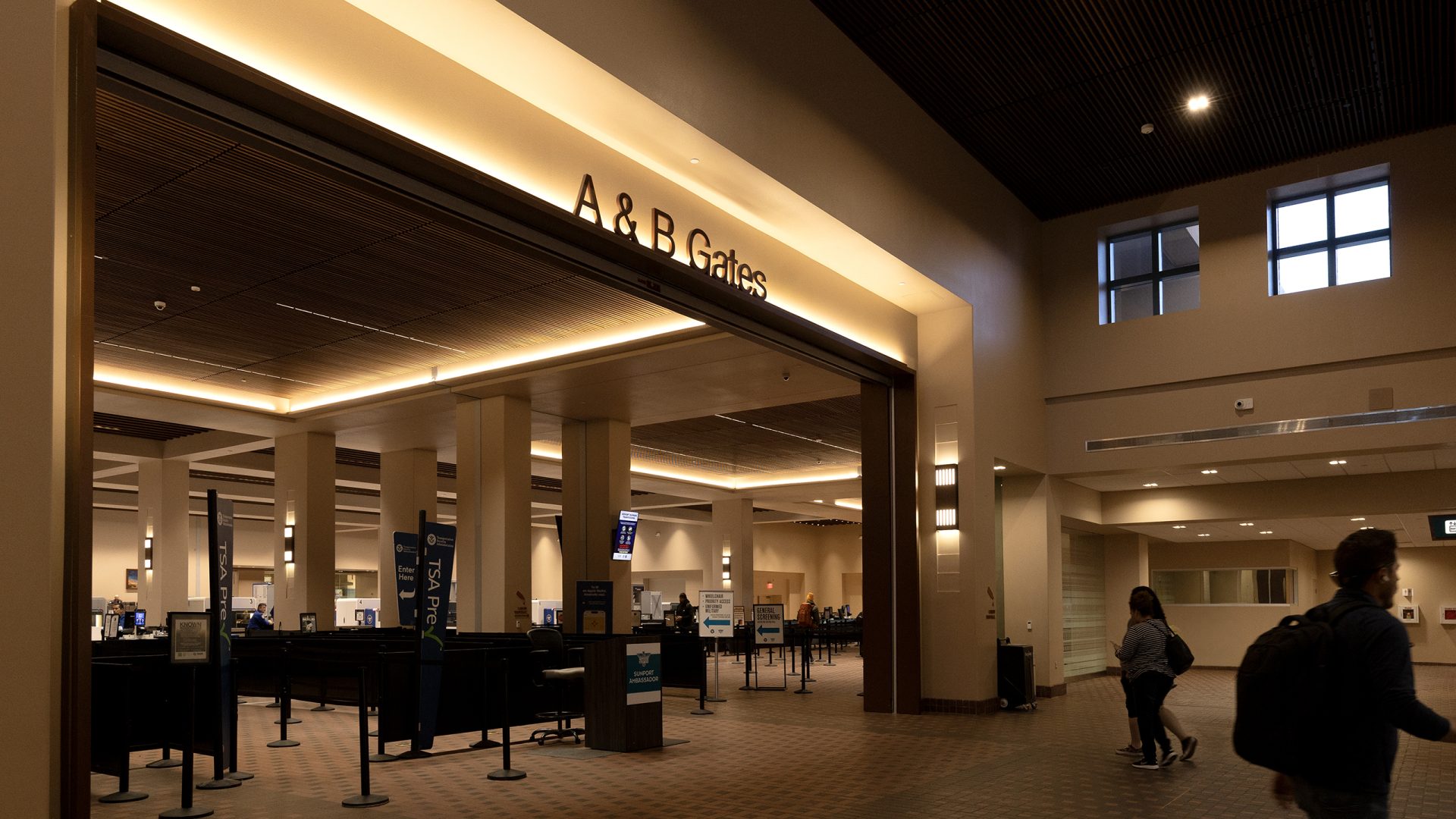Backlit channel letters identifying A and B gates at airport