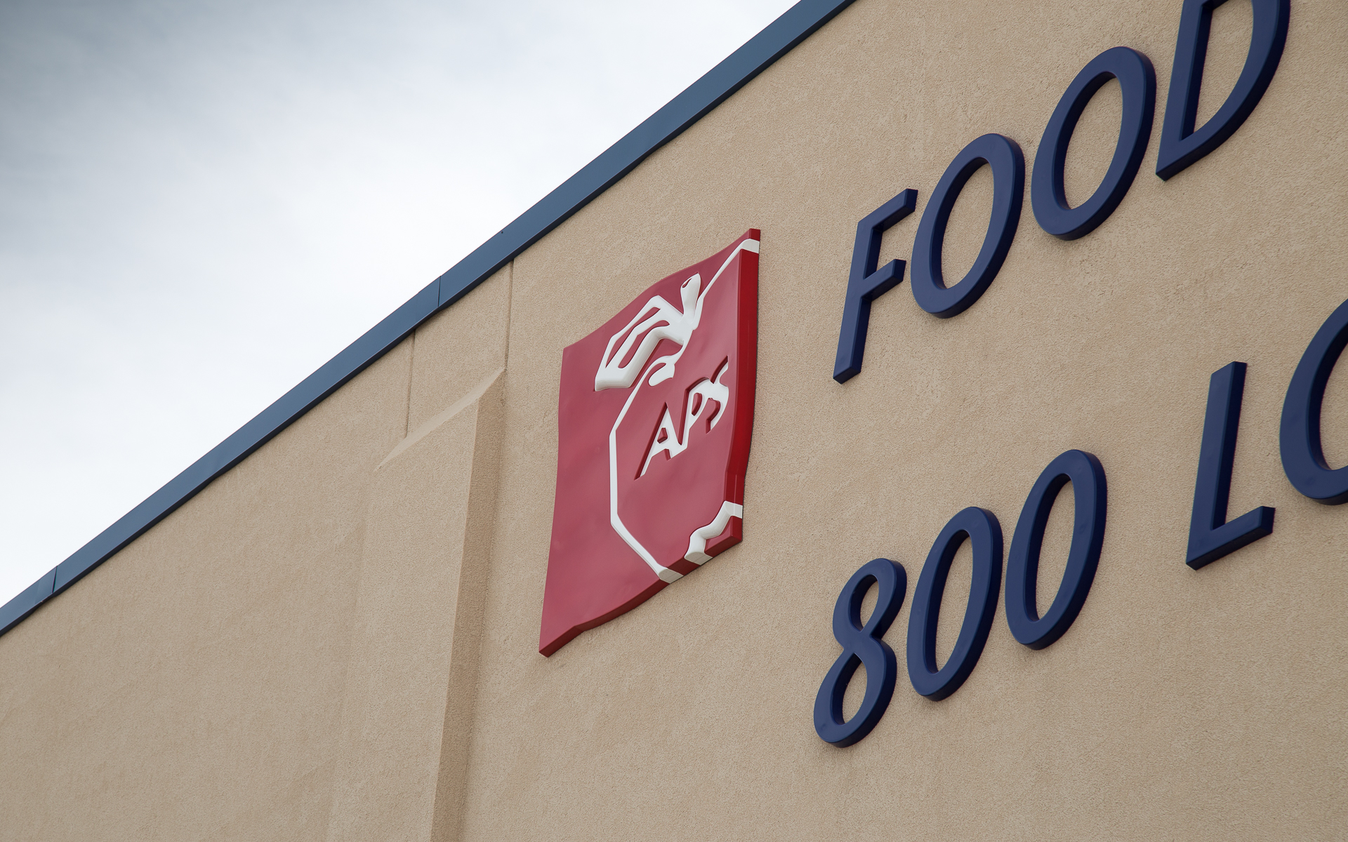 Exterior APS logo sign with dimensional formed plastic construction