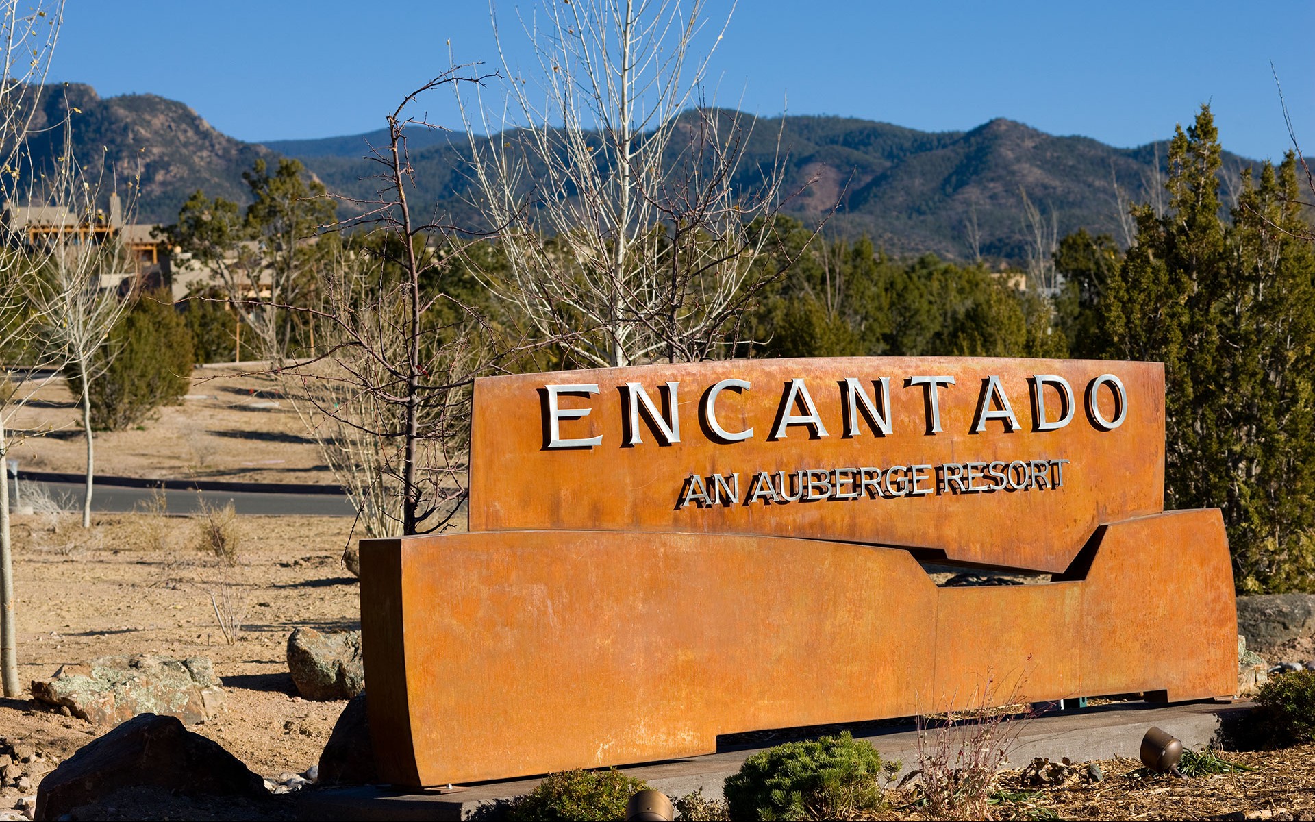 Monument sign with flat cut aluminum dimensional letters on corten steel at Encantado Resort
