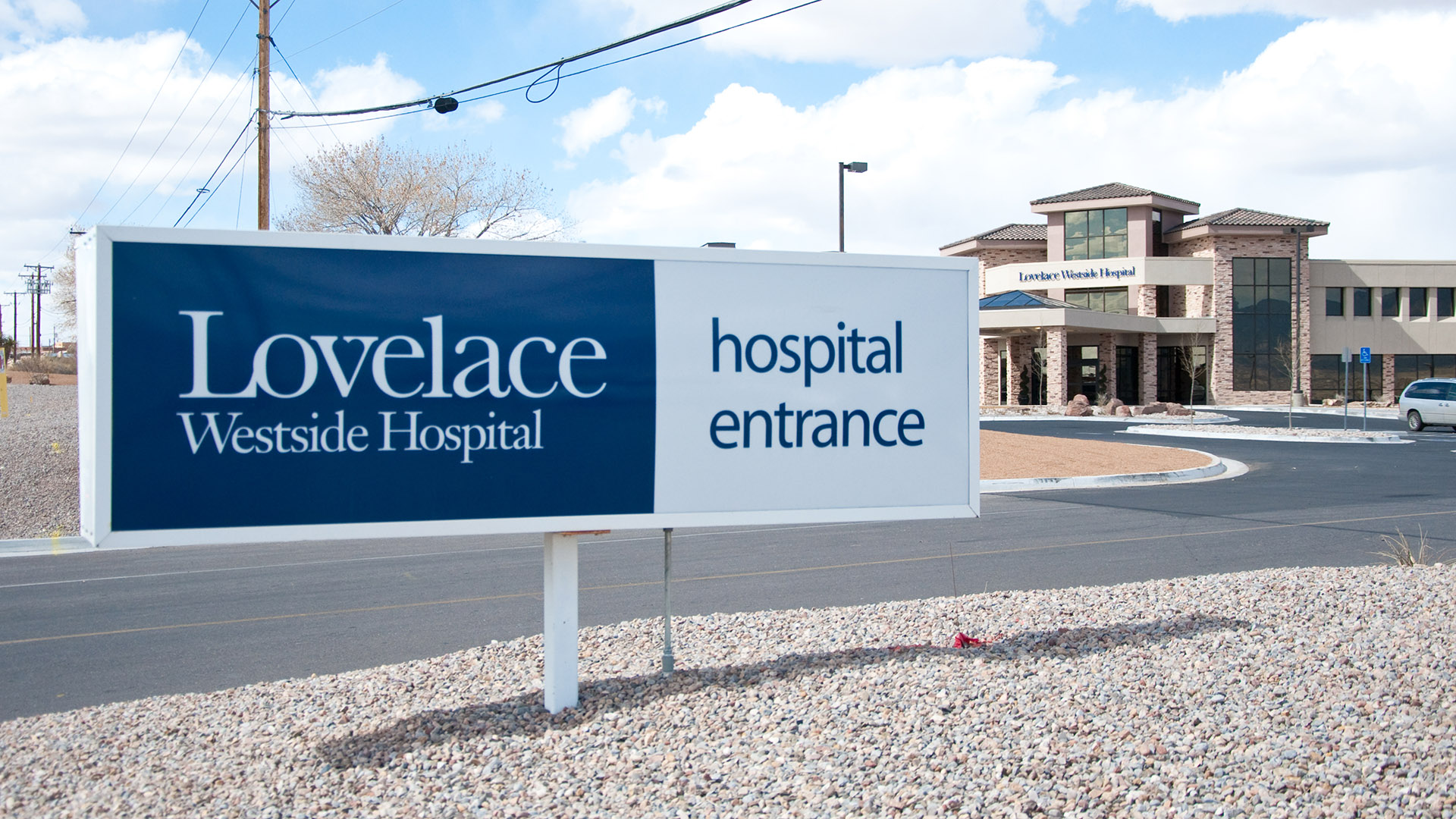 Exterior hospital wayfinding monument sign directing visitors to entrance and facilities at Lovelace Westside Hospital