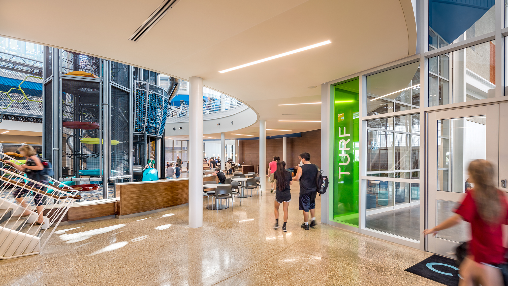 Turf window signage lime green vinyl graphics sign company Glass wall with lime green vinyl lettering marking turf zone installed by professional sign company