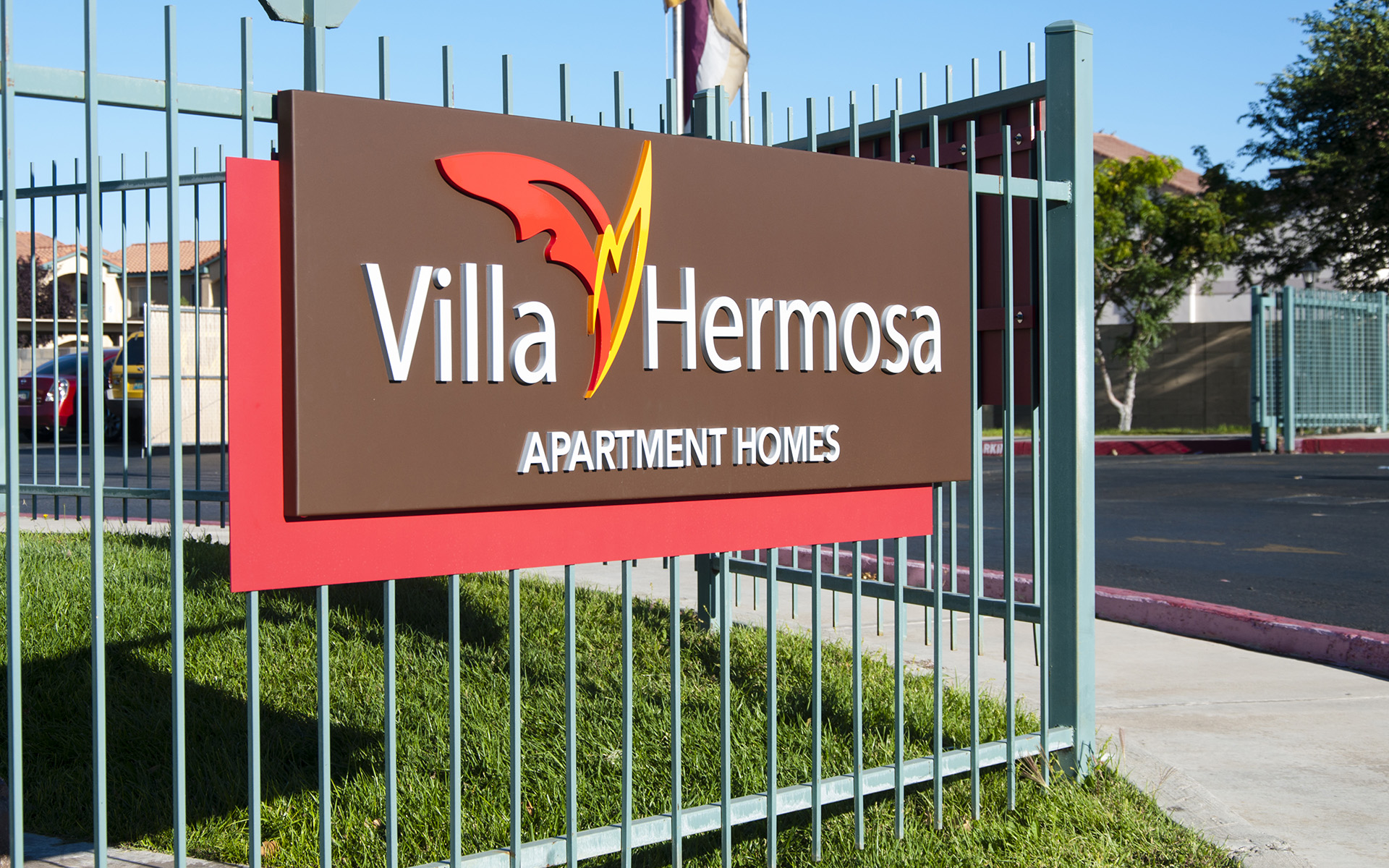 Apartment community monument sign with dimensional lettering and branded panel