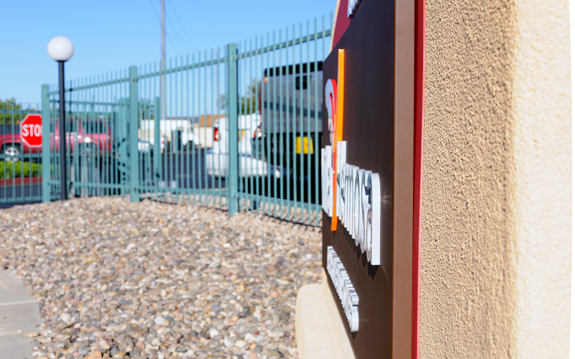 View of multiple monument signs along property perimeter reinforcing branding and wayfinding