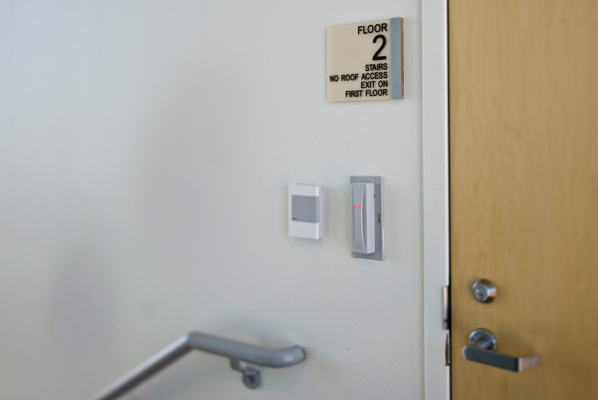 Interior stair signage with tactile and braille floor identification