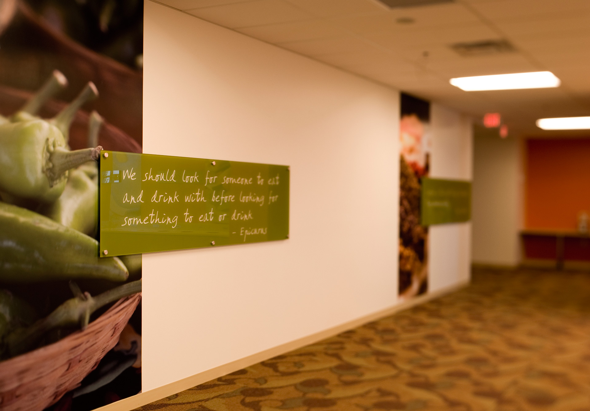 Acrylic mounted branding graphics integrated with interior wall design