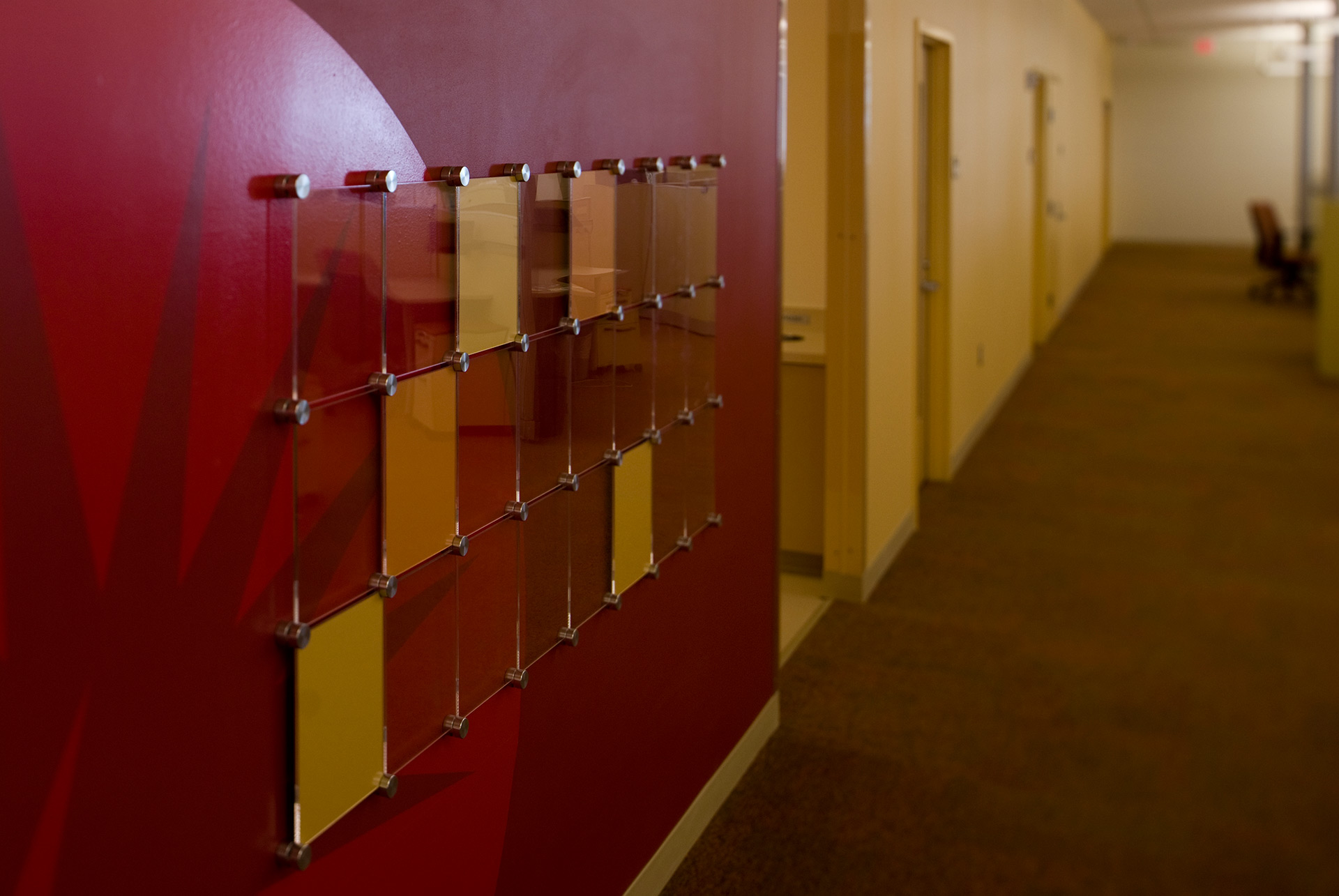 Long hallway with integrated environmental graphics and branding elements