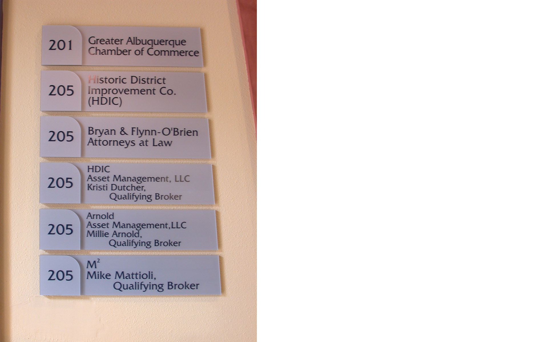 Interior building directory with one-inch changeable name signs for office tenant identification.