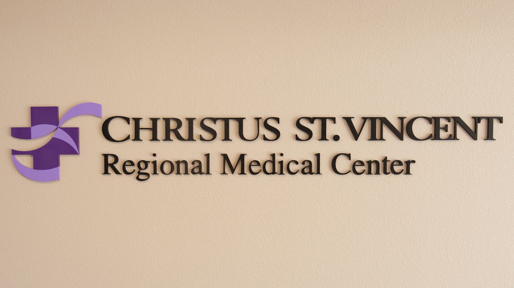 Dimensional aluminum letters and multicolor healthcare logo mounted in hospital lobby