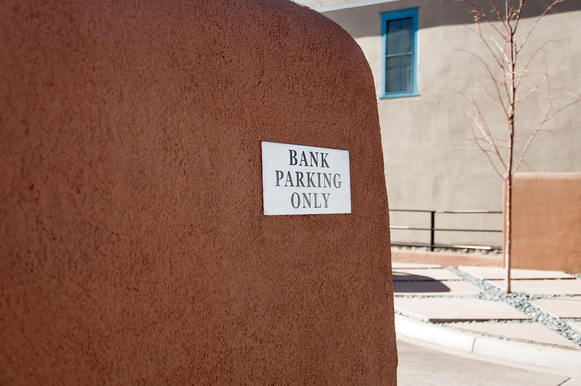 Directional one way and no right turn parking sign at First National Bank Santa Fe exterior