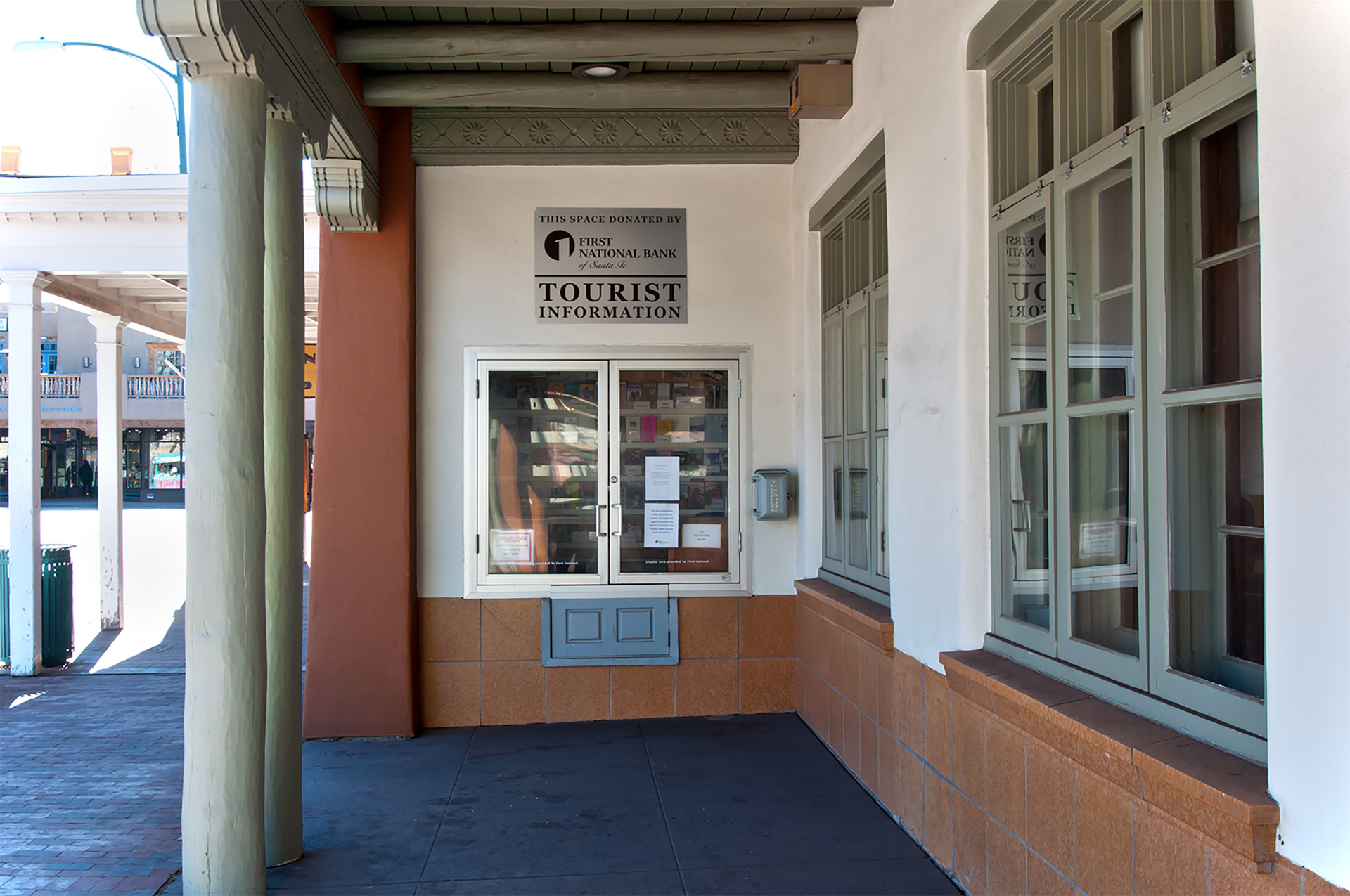 Tourist information and donor recognition sign at First National Bank Santa Fe exterior walkway