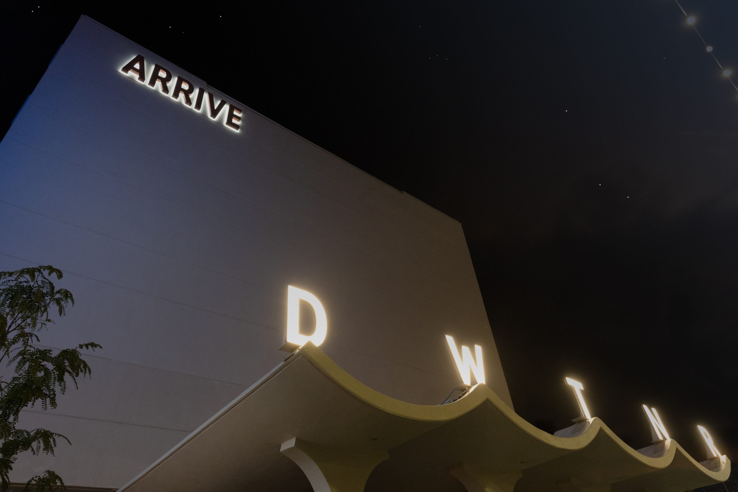 Exterior-Illuminated-Letters-Arrive Acrylic branding display system with second surface graphics and standoffs