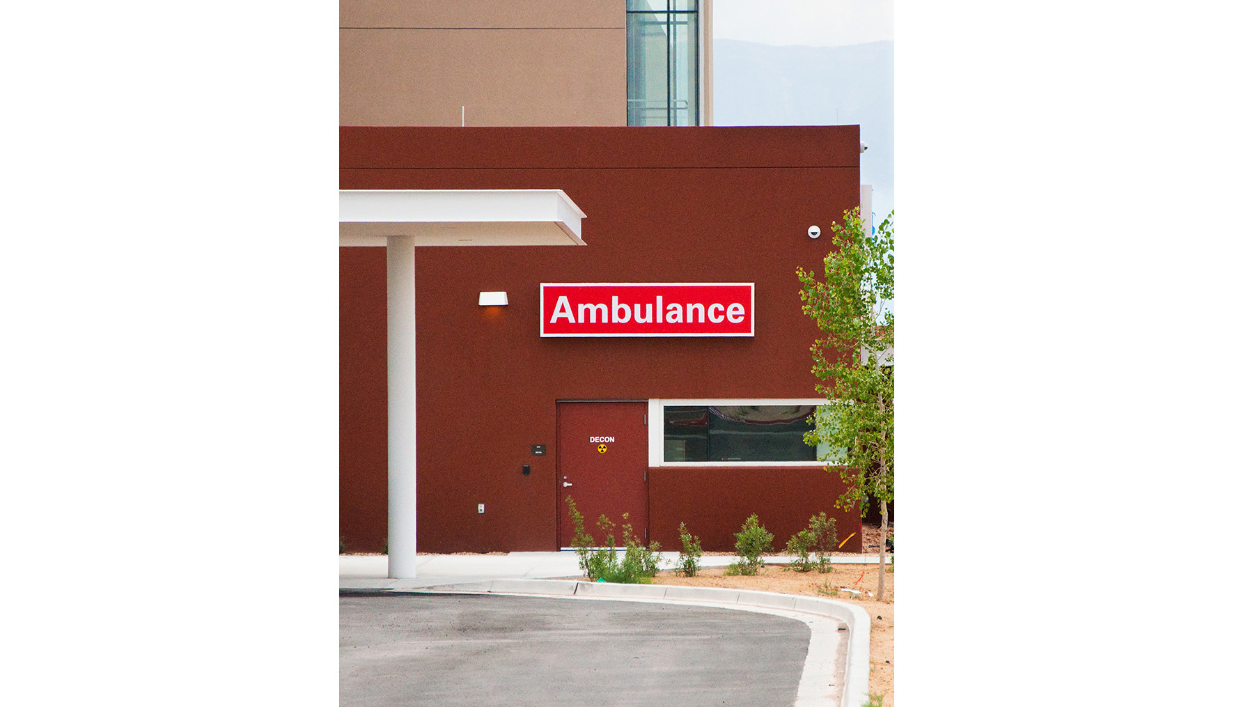 Wall-mounted ambulance directional sign cabinet at UNM Sandoval Regional Medical Center