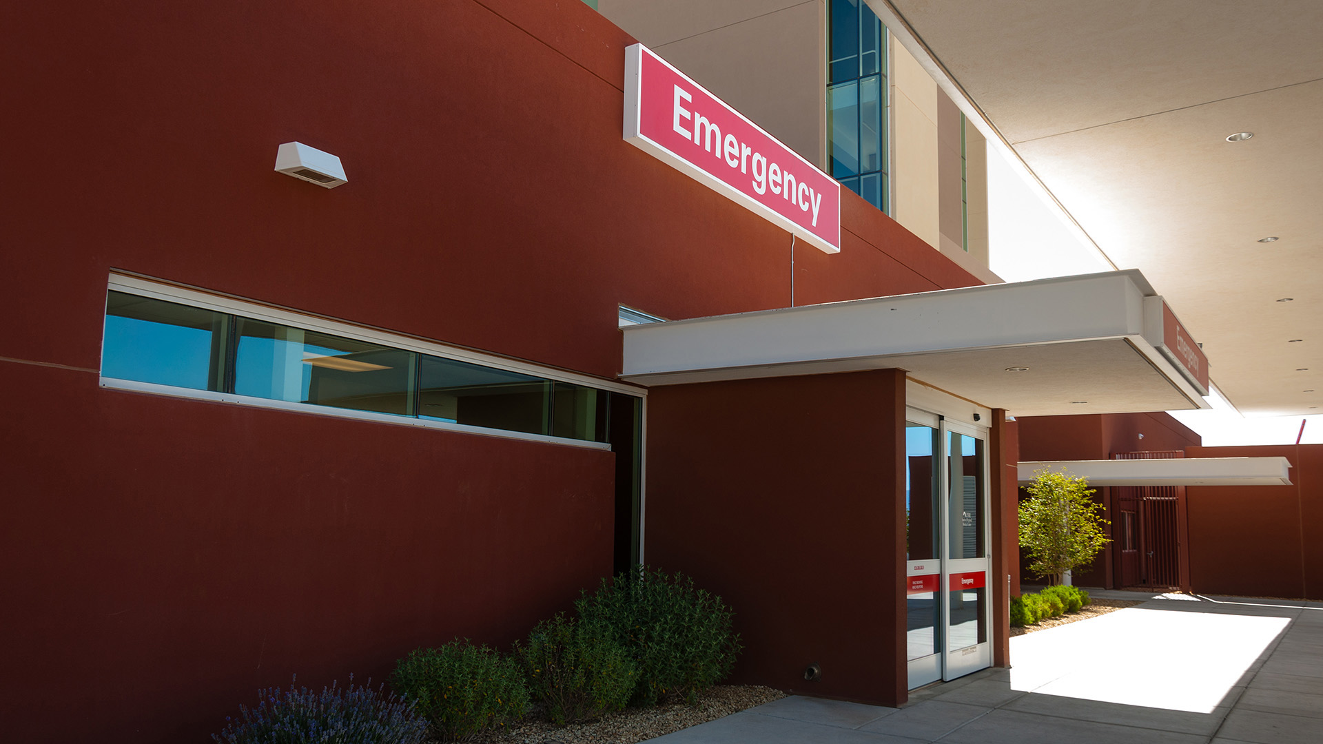 Wall-mounted emergency sign cabinet at UNM Sandoval Regional Medical Center