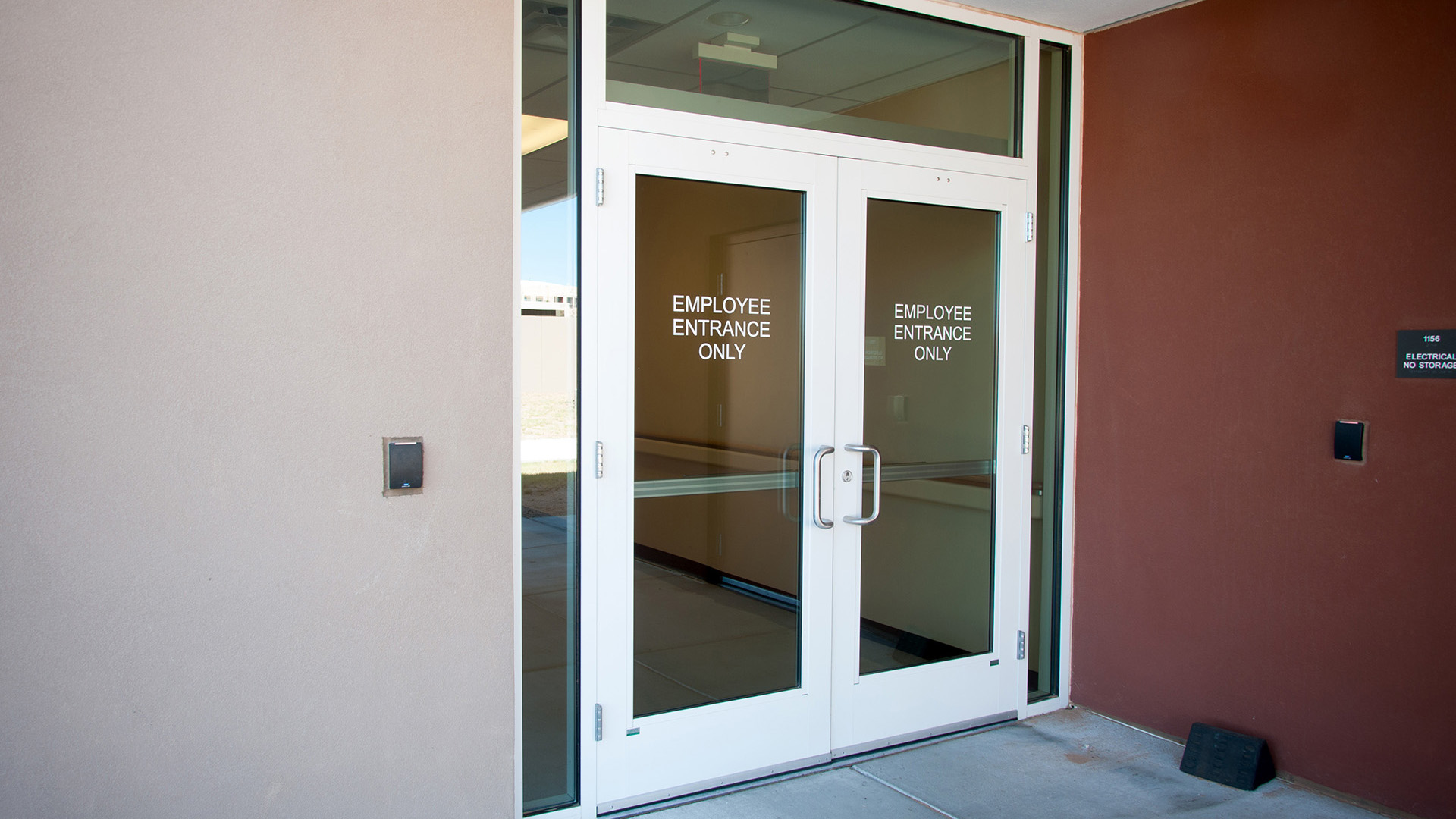 Vinyl lettering identifying the employee-only entrance at UNM Sandoval Regional Medical Center