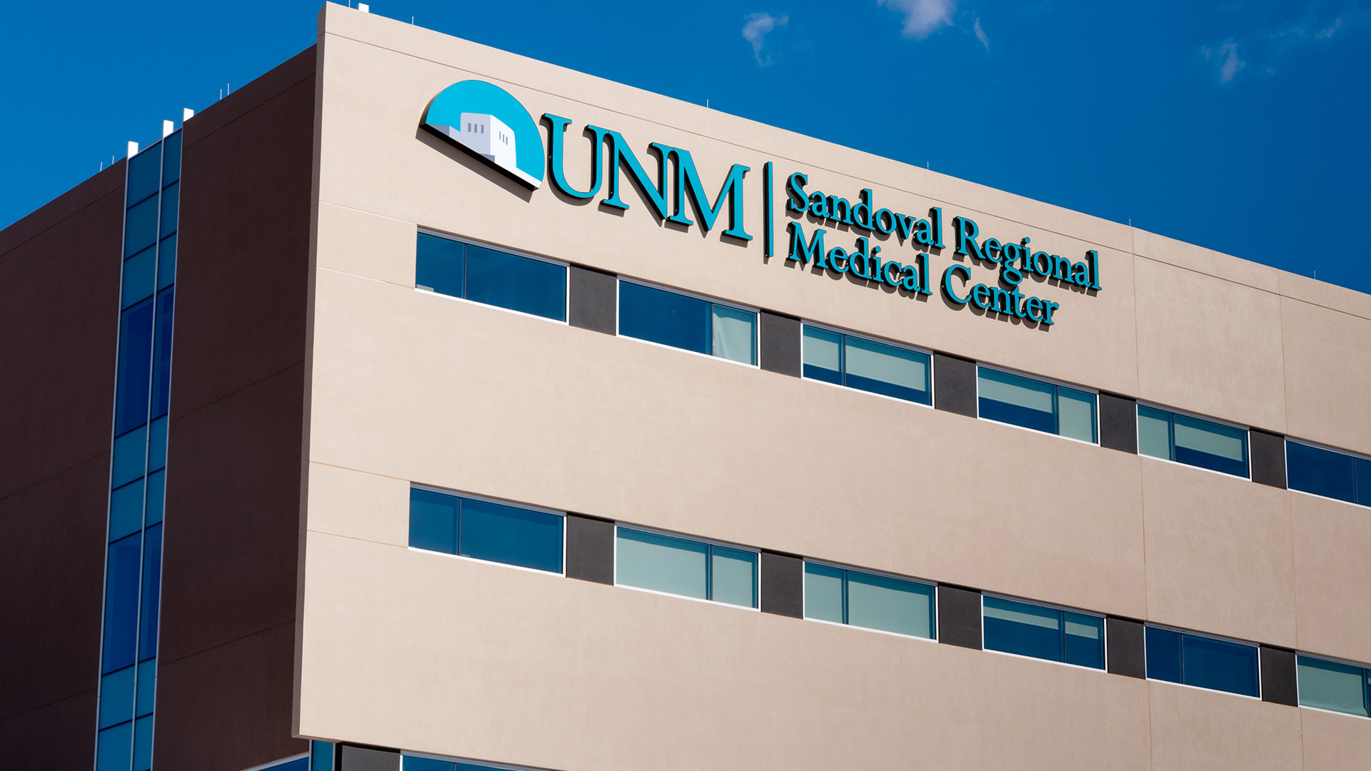 Close-up of illuminated channel letters at UNM Sandoval Regional Medical Center