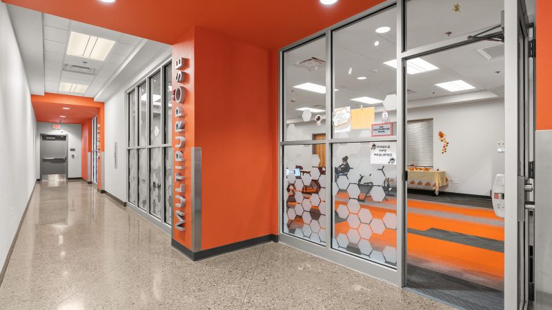 Vinyl Window Graphics Frosted Crystal Applied Second Surface Glass wall with lime green vinyl lettering marking turf zone installed by professional sign company