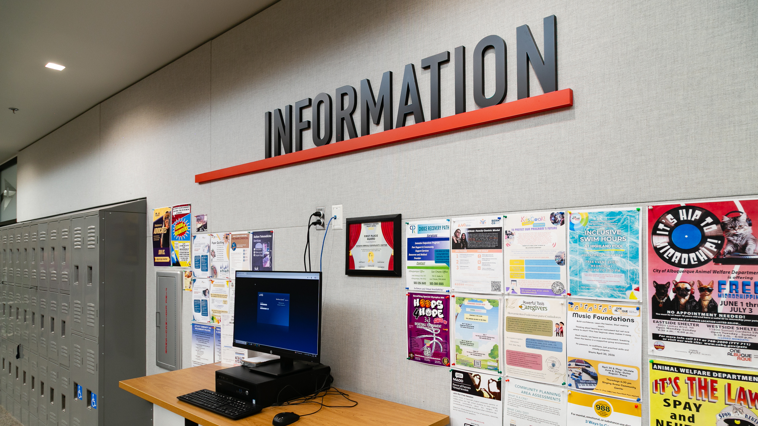 Wide view of Information Desk dimensional letters and community bulletin area