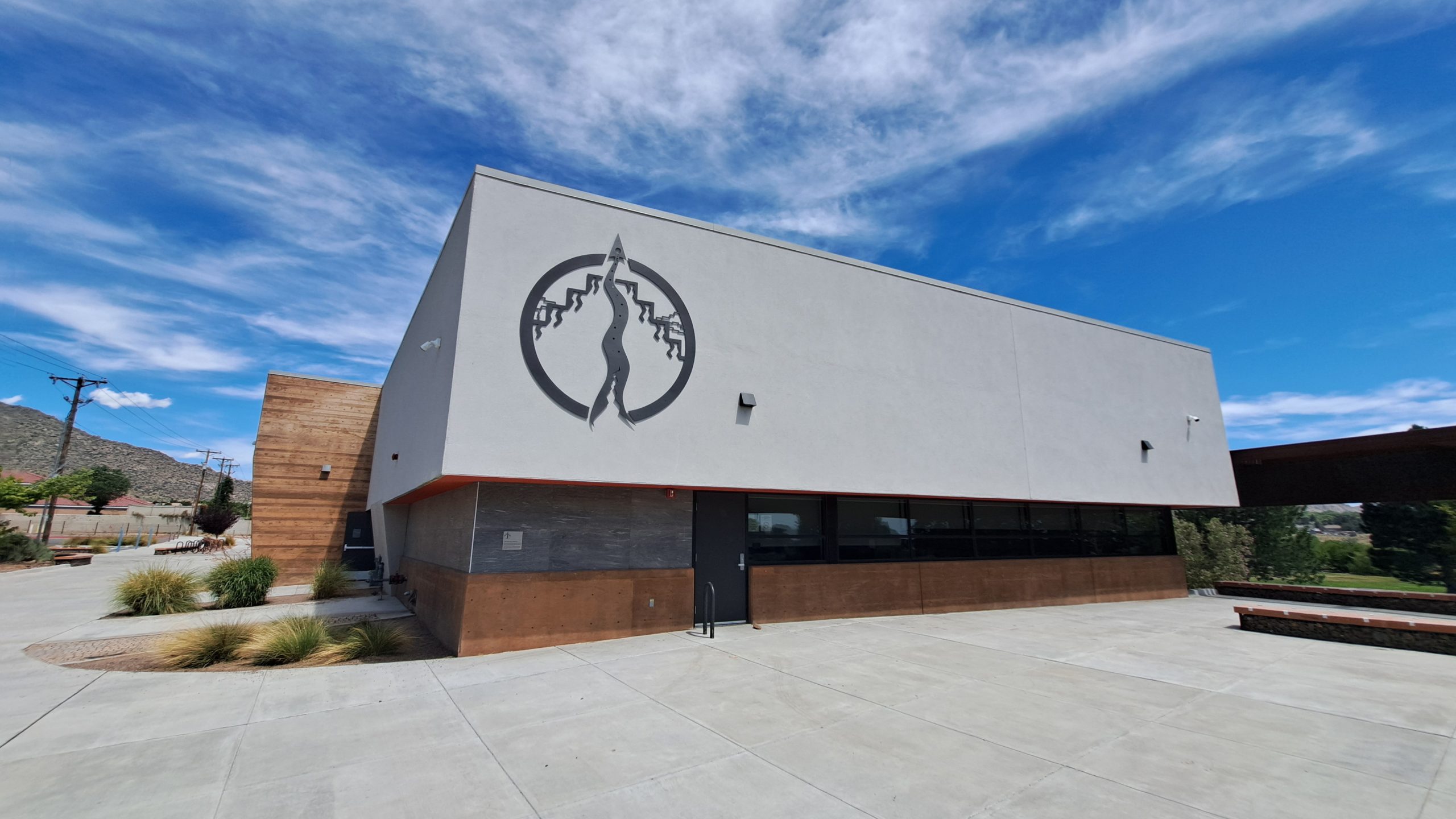 Singing Arrow Community Center Exterior Elevation Featuring a Wall-Mounted Dimensional Flat-Cut Aluminum Symbol